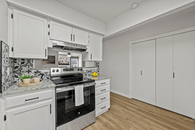 kitchen with decorative backsplash, white cabinetry, stainless steel range with electric cooktop, and light hardwood / wood-style flooring