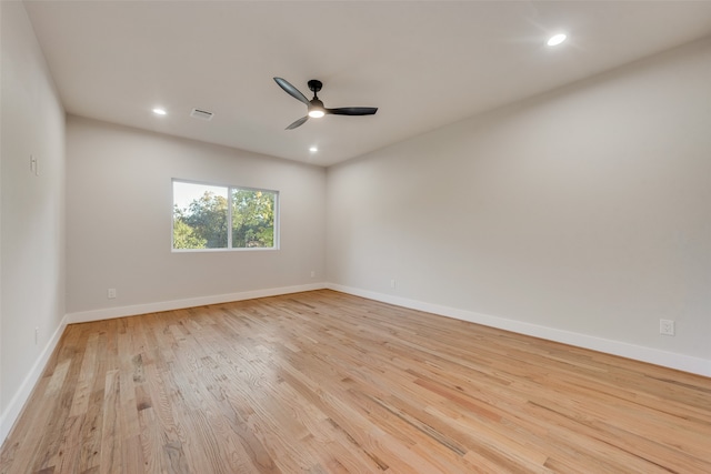 spare room with light hardwood / wood-style flooring and ceiling fan