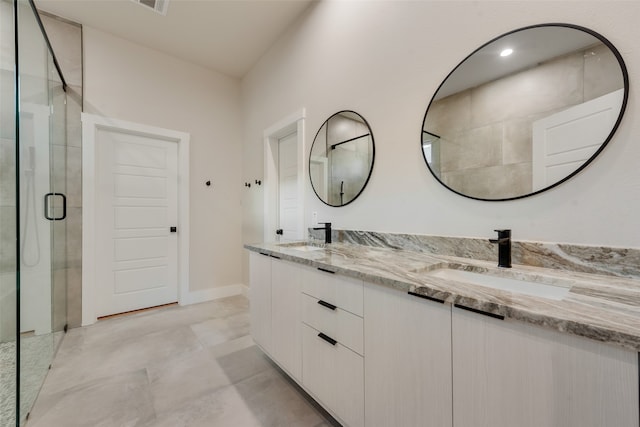 bathroom with vanity and an enclosed shower