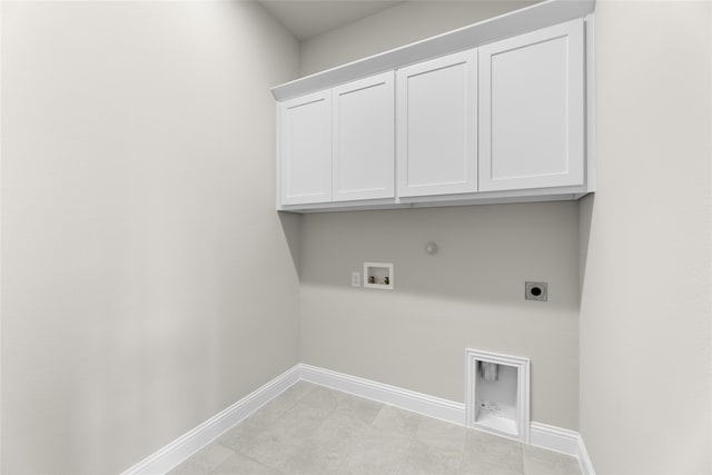 clothes washing area featuring cabinets, washer hookup, light tile patterned floors, hookup for a gas dryer, and hookup for an electric dryer