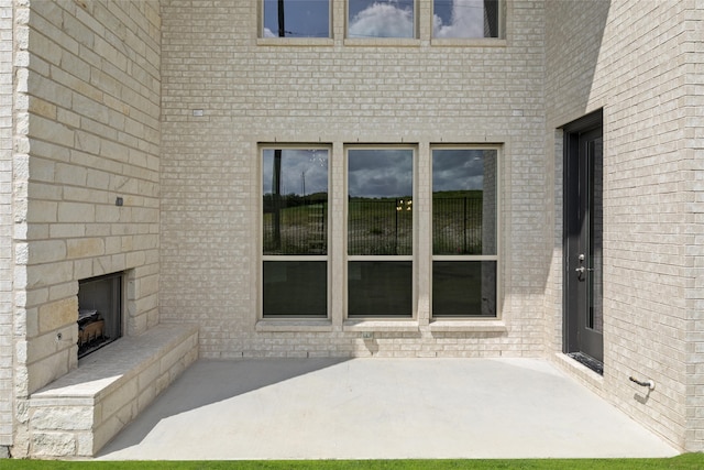 view of patio / terrace with a fireplace