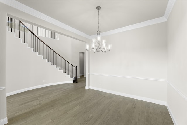 interior space featuring dark wood-type flooring, crown molding, and a chandelier