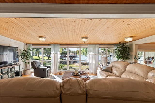 living room featuring wood ceiling and plenty of natural light