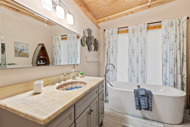 bathroom with a bath, wooden ceiling, wood-type flooring, and vanity