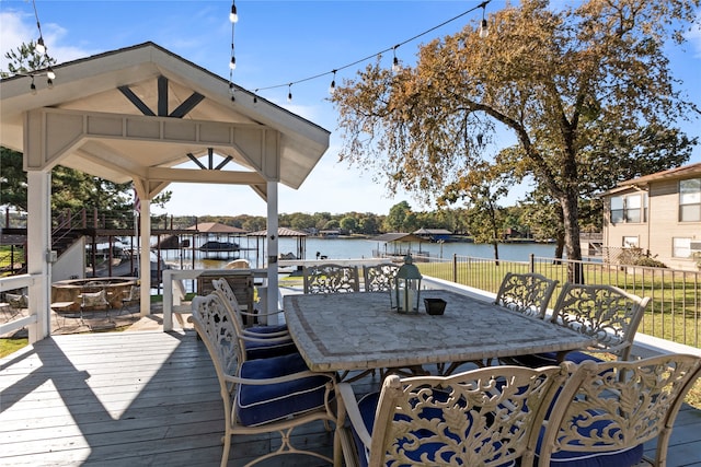 wooden deck featuring a water view