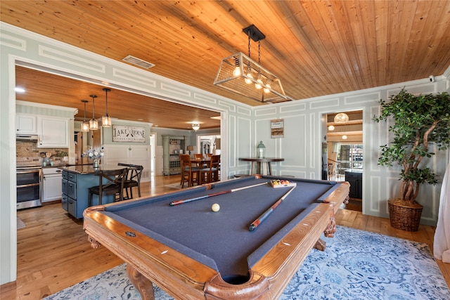 rec room featuring ornamental molding, light hardwood / wood-style flooring, billiards, and wooden ceiling