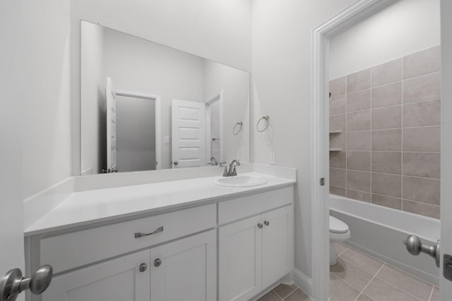 bathroom featuring shower / bath combination, toilet, vanity, and tile patterned flooring