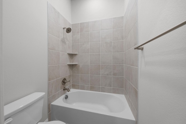 bathroom featuring toilet and shower / tub combination