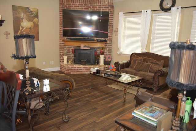 living room with hardwood / wood-style floors and a brick fireplace