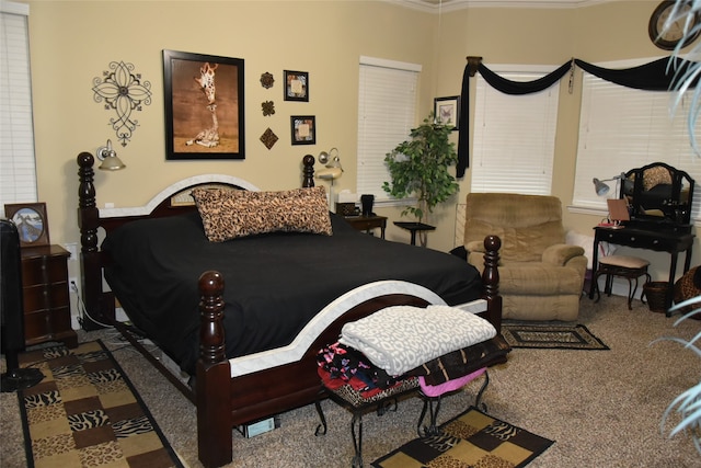 carpeted bedroom with ornamental molding