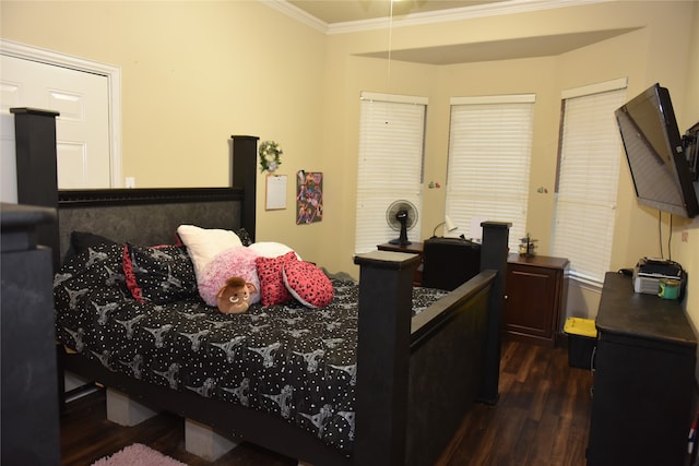 bedroom featuring dark hardwood / wood-style flooring and ornamental molding