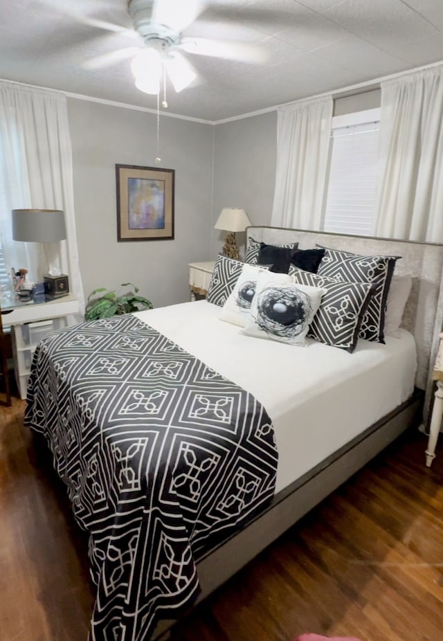 bedroom featuring dark wood-type flooring and ceiling fan