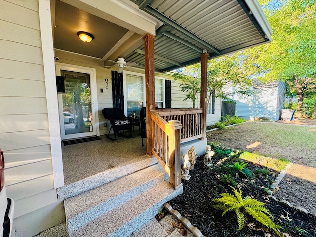 property entrance featuring ceiling fan and a porch