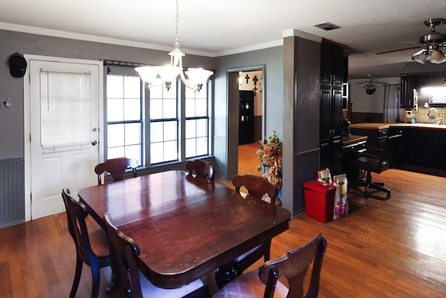 101 Scenic Dr, Dublin, TX 76446 - dining room featuring a chandelier, wood finished floors, ornamental molding, and ceiling fan