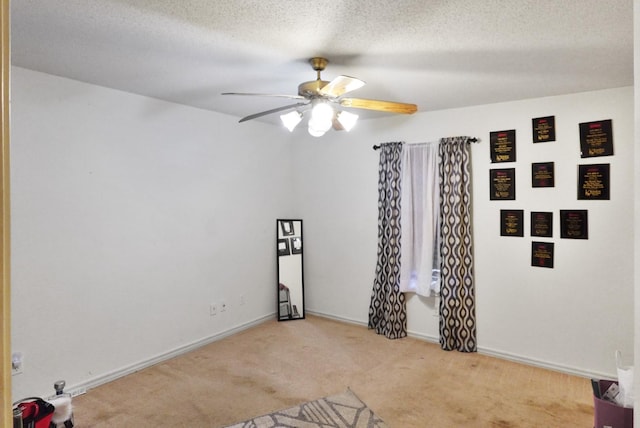 101 Scenic Dr, Dublin, TX 76446 - unfurnished room featuring carpet floors, ceiling fan, baseboards, and a textured ceiling