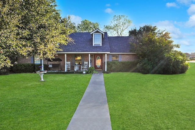 101 Scenic Dr, Dublin, TX 76446 - view of front of house with a front yard, covered porch, brick siding, and roof with shingles