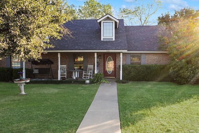 101 Scenic Dr, Dublin, TX 76446 - view of front of house featuring covered porch, a front lawn, and a shingled roof