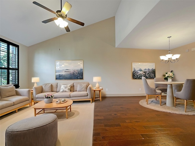 living room featuring dark hardwood / wood-style floors, high vaulted ceiling, and ceiling fan with notable chandelier