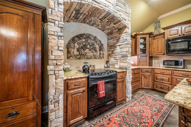 kitchen with decorative backsplash, light stone countertops, vaulted ceiling, ornamental molding, and black appliances