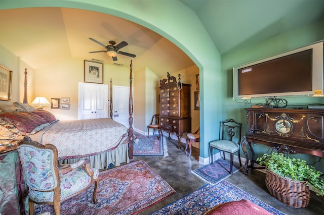 bedroom featuring ceiling fan, dark carpet, and vaulted ceiling