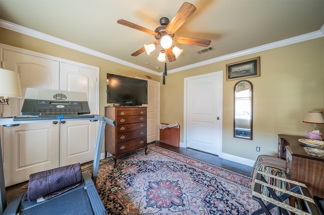 interior space featuring crown molding, a closet, and ceiling fan