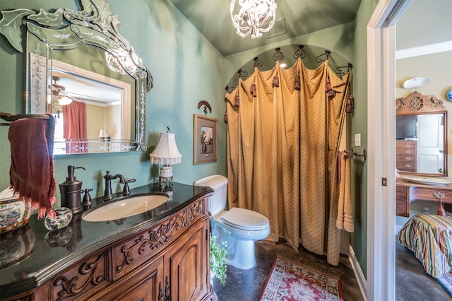 bathroom featuring toilet, crown molding, vanity, and ceiling fan