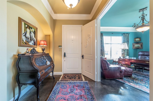 foyer entrance featuring ornamental molding