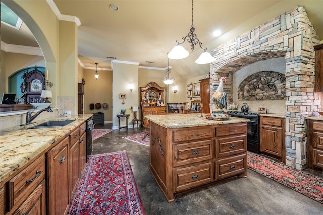 kitchen featuring tasteful backsplash, black appliances, sink, a center island, and hanging light fixtures