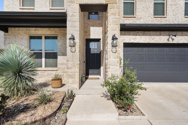 view of exterior entry featuring a garage