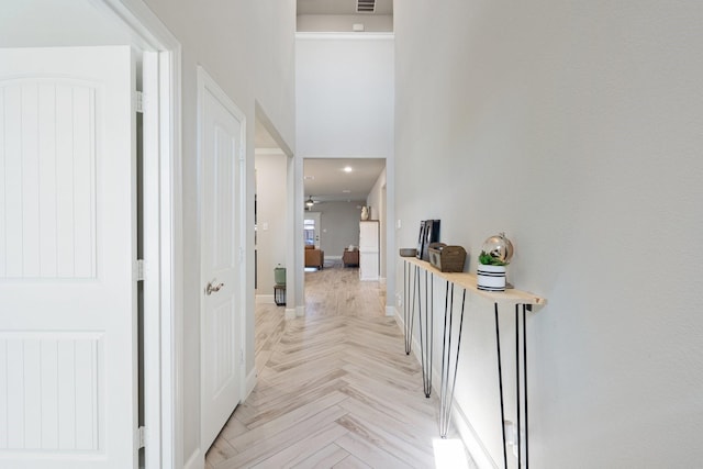 hallway with light parquet floors