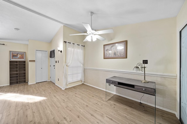 misc room featuring vaulted ceiling, ceiling fan, and light hardwood / wood-style floors