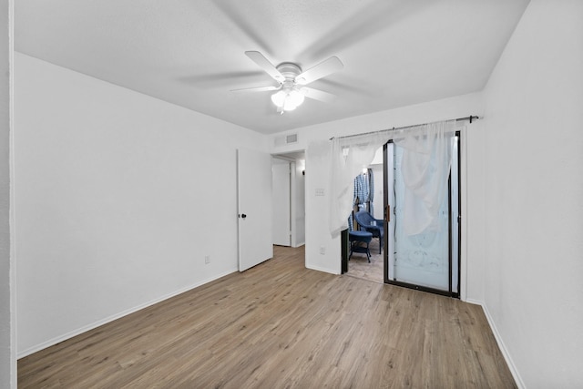 unfurnished bedroom featuring ceiling fan and light hardwood / wood-style floors