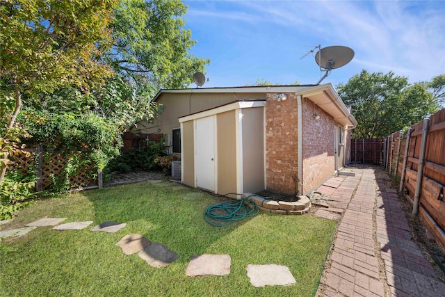 view of outbuilding featuring a lawn