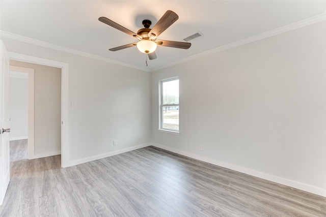 spare room with light hardwood / wood-style floors, crown molding, and ceiling fan