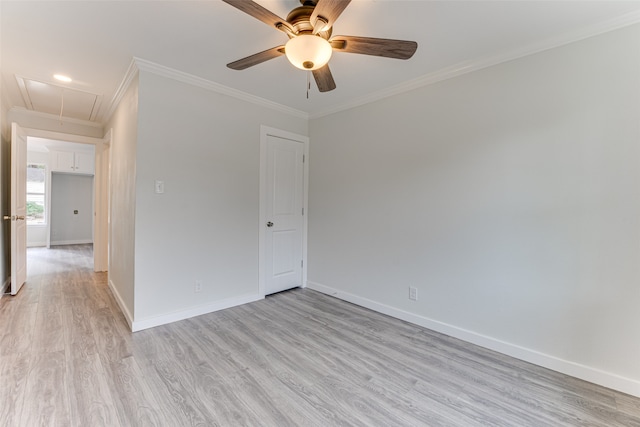 spare room featuring light hardwood / wood-style floors, crown molding, and ceiling fan