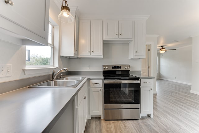 kitchen with white cabinetry, hanging light fixtures, sink, and stainless steel electric range oven