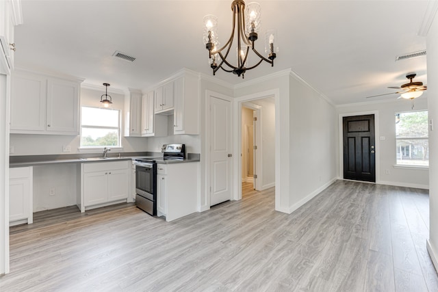 kitchen featuring white cabinetry, stainless steel electric range oven, light hardwood / wood-style floors, crown molding, and decorative light fixtures