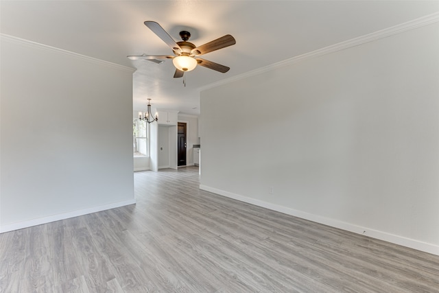 spare room with light hardwood / wood-style floors, ornamental molding, and ceiling fan with notable chandelier