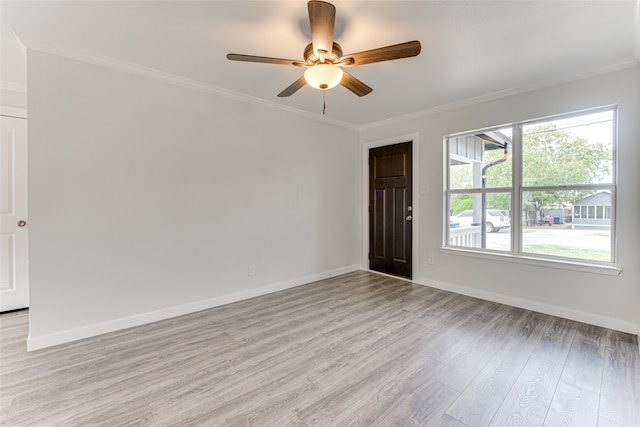 empty room with crown molding, light hardwood / wood-style flooring, and ceiling fan