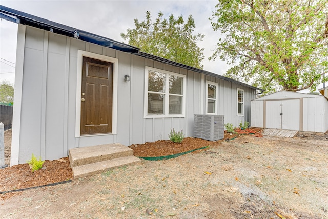 view of exterior entry with central AC unit