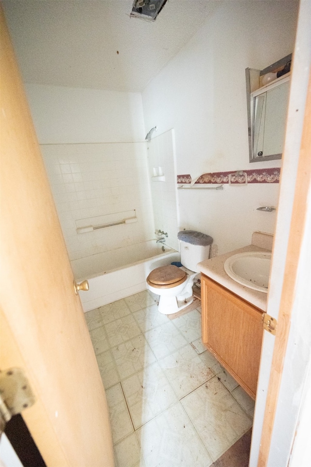 full bathroom featuring vanity, toilet, and tiled shower / bath combo