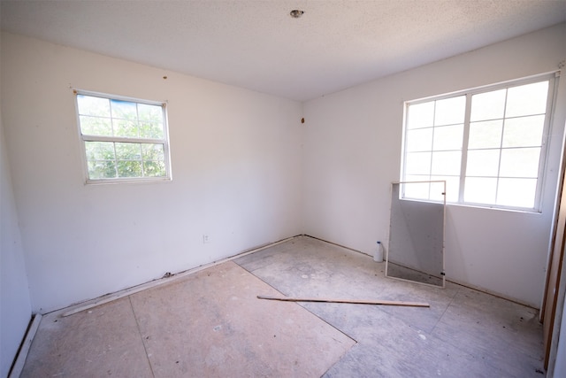 empty room featuring a textured ceiling