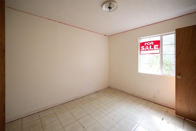 396 Fcr Unit 261, Oakwood, TX 75855 - unfurnished room featuring light floors and a textured ceiling