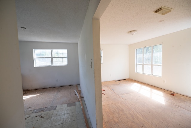 empty room featuring a textured ceiling