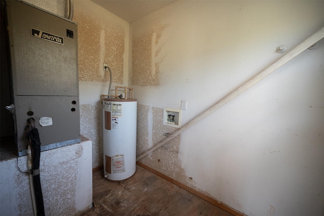 396 Fcr Unit 261, Oakwood, TX 75855 - utility room with electric water heater and heating unit