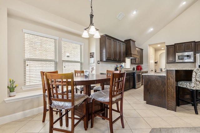 dining room featuring an inviting chandelier, light tile patterned flooring, and high vaulted ceiling