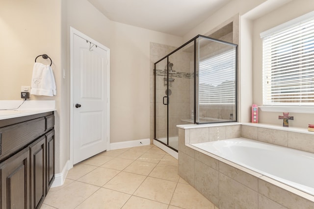 bathroom with vanity, plus walk in shower, and tile patterned floors