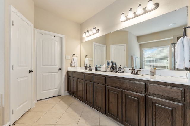 bathroom with vanity and tile patterned flooring