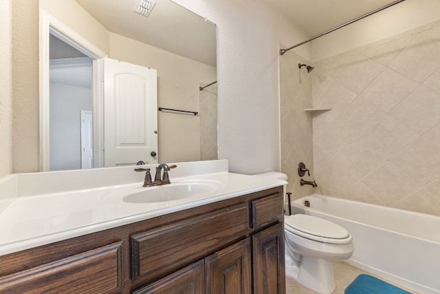 full bathroom with vanity, tiled shower / bath combo, toilet, and tile patterned floors