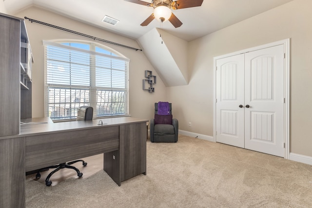 carpeted office with ceiling fan and vaulted ceiling